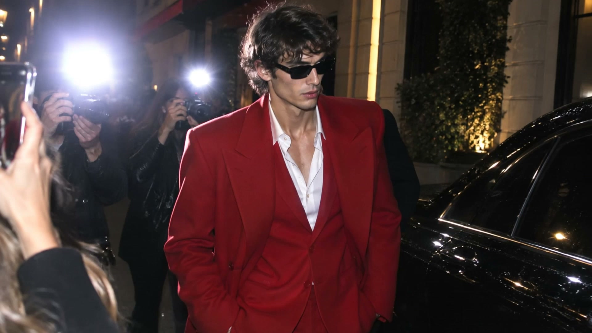 AI video result — Transform the uploaded image into an ultra-realistic celebrity paparazzi video while perfectly preserving the…