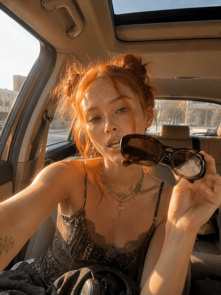 In Car location for an AI marketing video — inside a car with dashboard and windshield view
